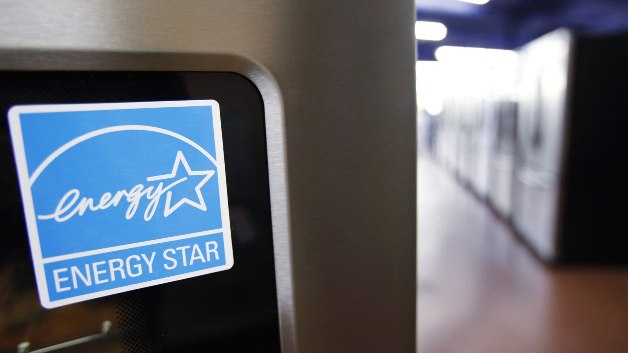 appliance with Energy Star logo sticker in forefront and hallway blurred behind it.